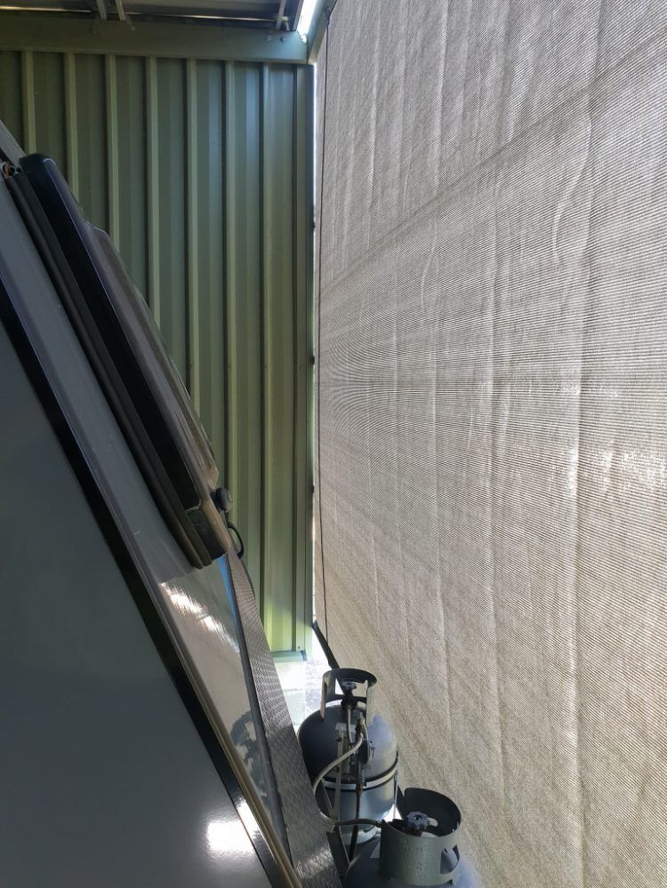 A Car is Parked in a Garage Next to a Wall — Cooloola Sail Company In Rainbow Beach, QLD