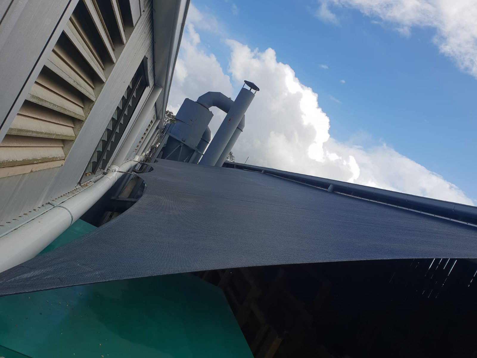 Looking Up at the Roof of a Building With a Blue Sky in the Background — Cooloola Sail Company In Cooloola Cove, QLD
