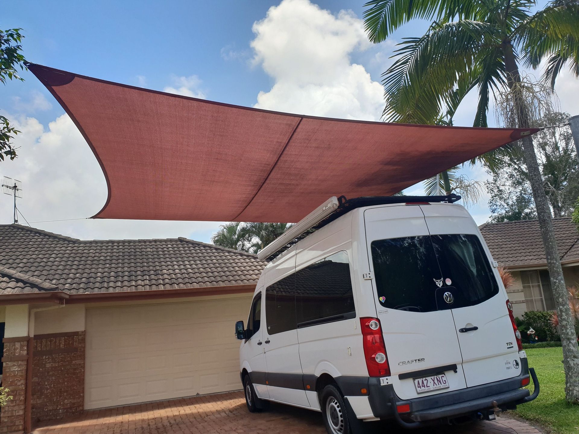 A White Van is Parked Under a Canopy in Front of a House — Cooloola Sail Company In Southside, QLD