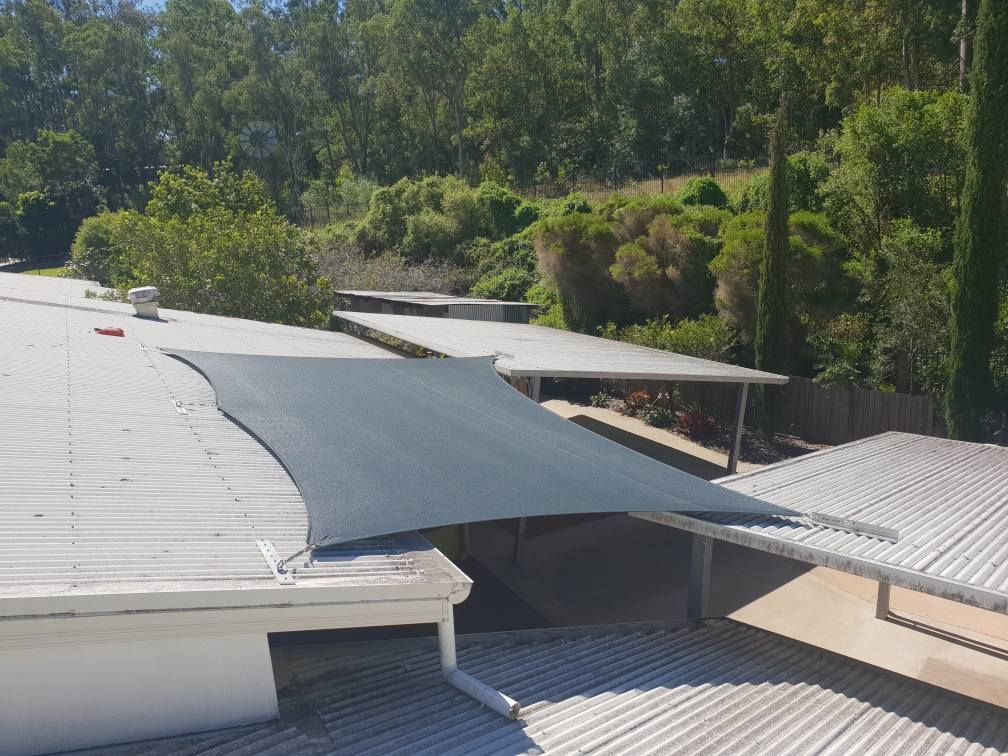 There is a Shade Sail on the Roof of a Building — Cooloola Sail Company In Tin Can Bay, QLD