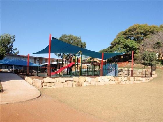 A playground with a slide and a few shades — Cooloola Sail Company In Tin Can Bay, QLD