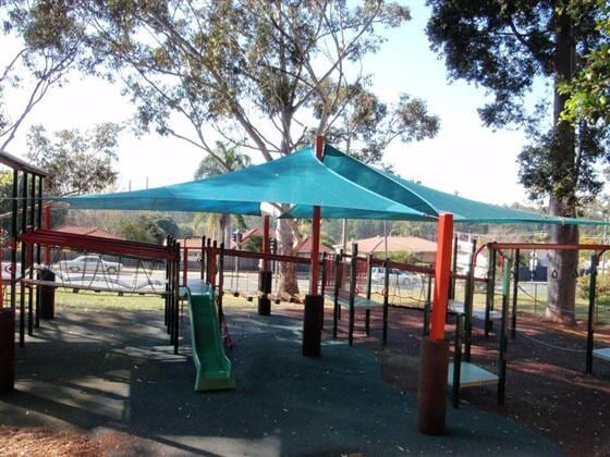 A Playground With Blue Umbrellas and a Slide — Cooloola Sail Company In Eumundi, QLD