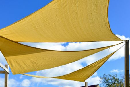 A Group of Yellow Shade Sails Against a Blue Sky — Cooloola Sail Company In Cooloola Cove, QLD