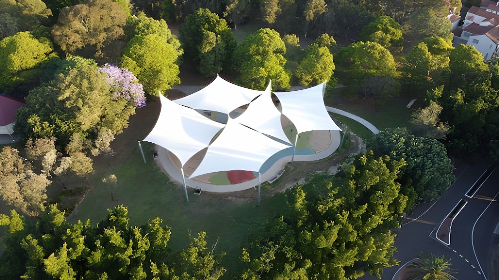 An Aerial View of a Tent in a Park Surrounded by Trees — Cooloola Sail Company In Southside, QLD