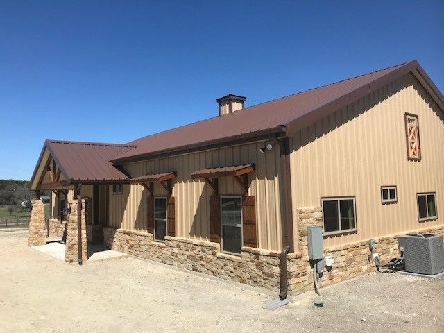 Wood and stone combination siding for a barndominium 