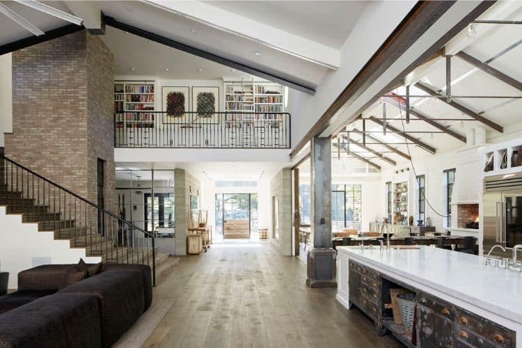 Modern Barndominium Interior shoing a kitchen, living room, and open floorplan.