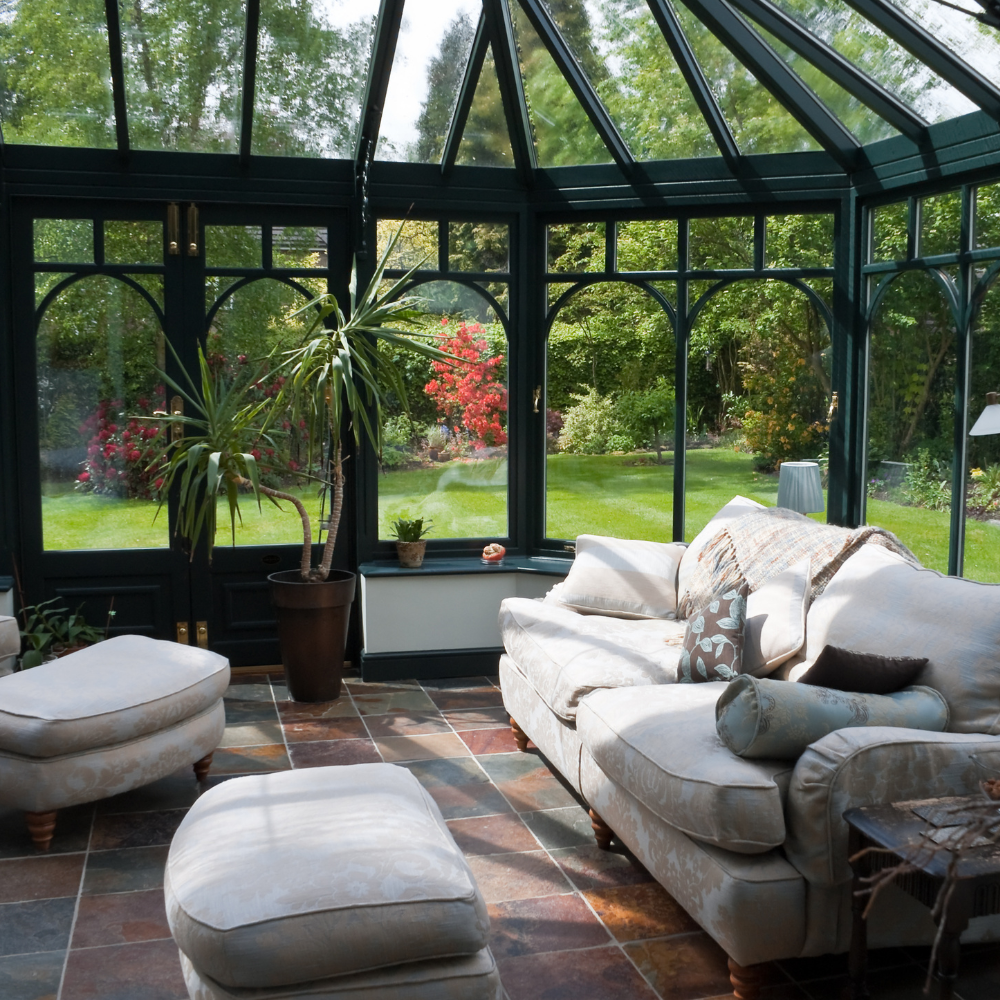 Sunroom with tall glass ceiling and beautiful modern elegant furniture