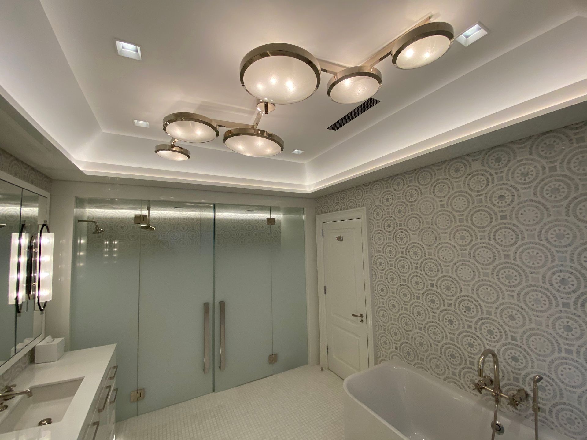 A bathroom with a bathtub a sink and a shower