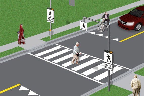 An illustration of a crosswalk with pedestrians and cars
