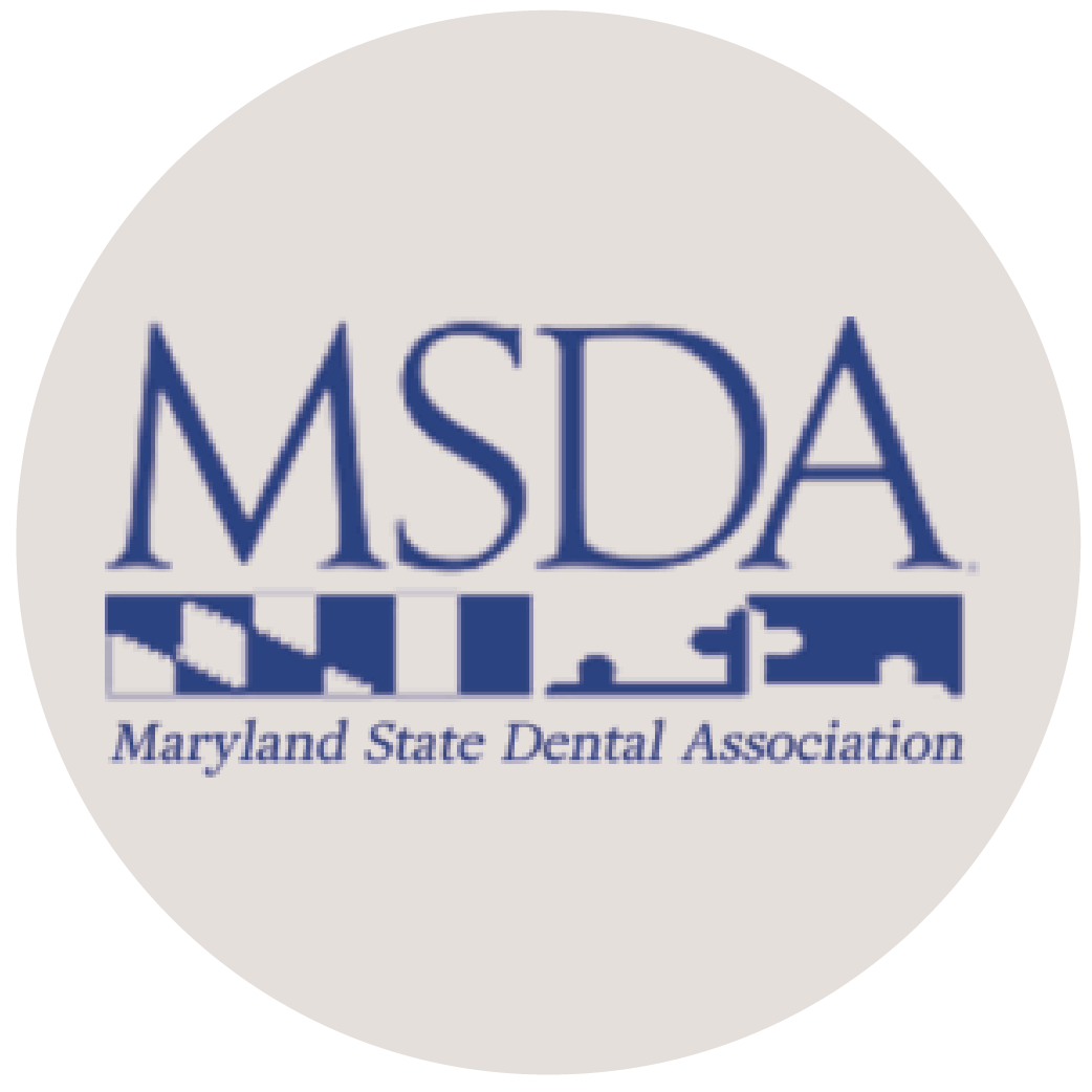 Maryland State Dental Association logo in blue on a light gray circle