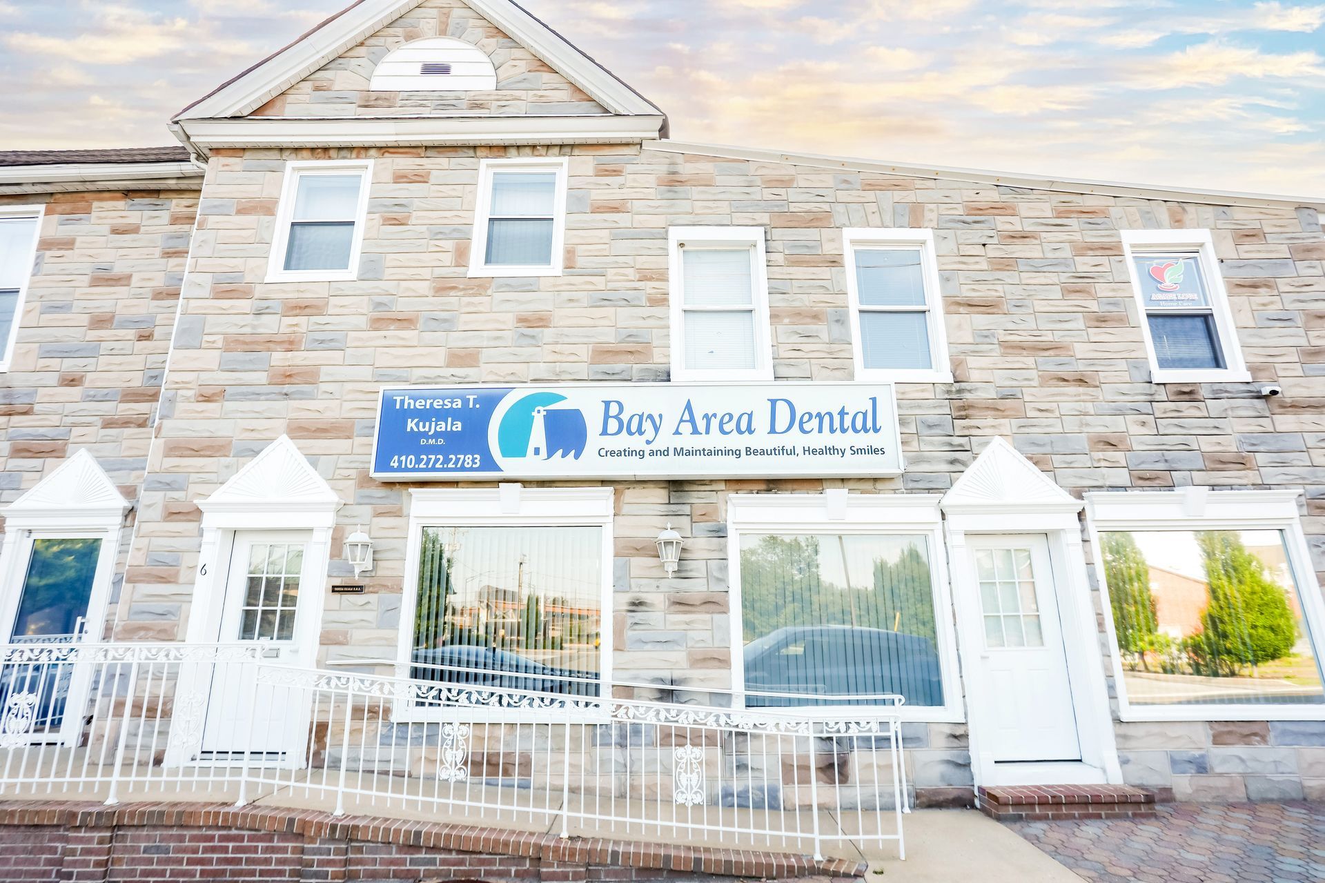 Exterior of Bay Area Dental office with stone facade and large front windows
