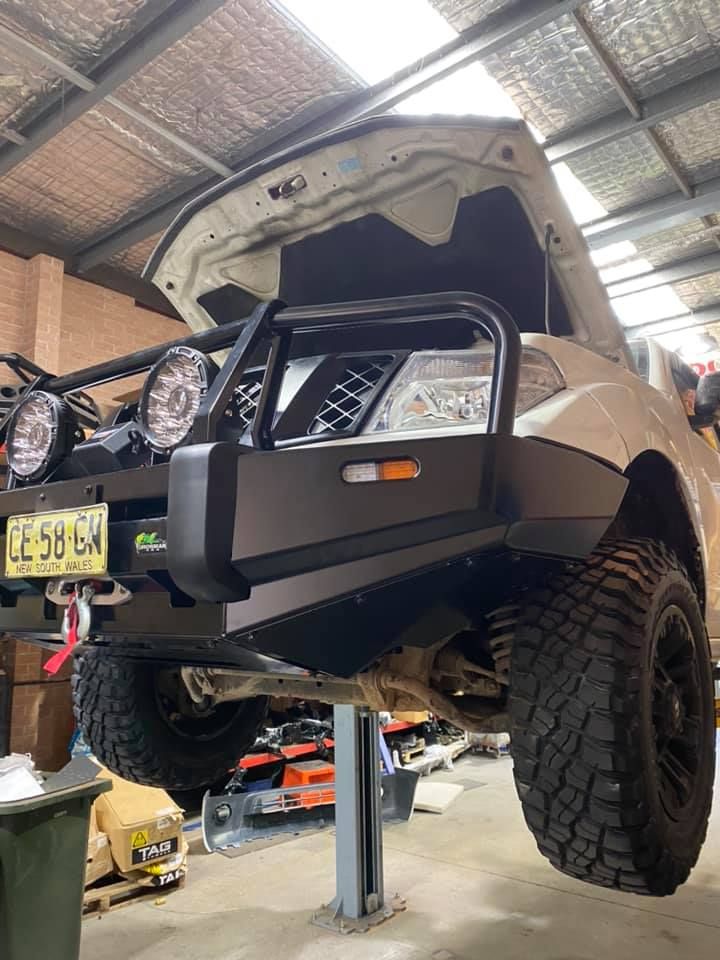 A Large Brick Building with A Lot of Windows — Bonetig's Mobile Towbars & Trailers In Oak Flats, NSW
