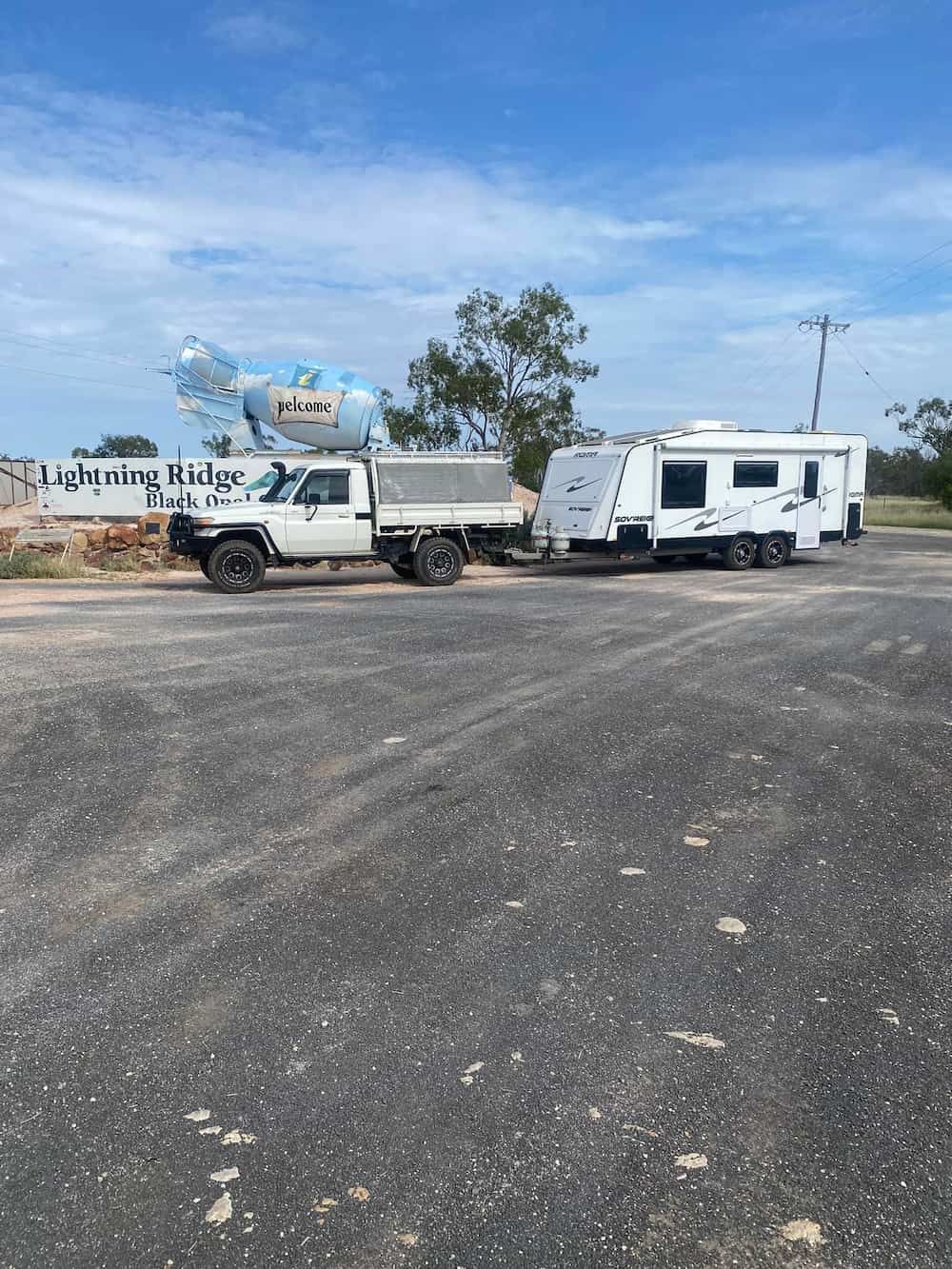 A Truck Is Towing a Trailer in A Parking Lot — Bonetig's Mobile Towbars & Trailers In Oak Flats, NSW
