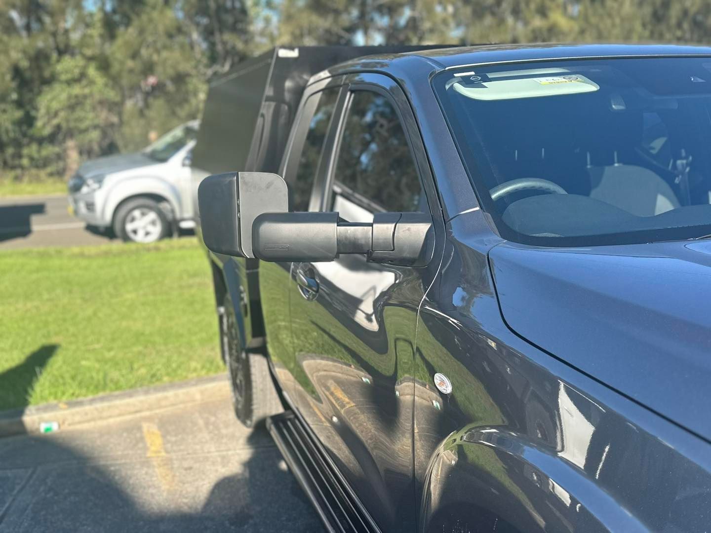A Black Truck Is Parked in A Parking Lot — Bonetig's Mobile Towbars & Trailers In Oak Flats, NSW
