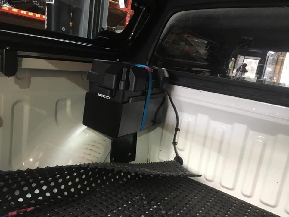 A Black Box Is Sitting in The Back of A White Truck — Bonetig's Mobile Towbars & Trailers In Oak Flats, NSW
