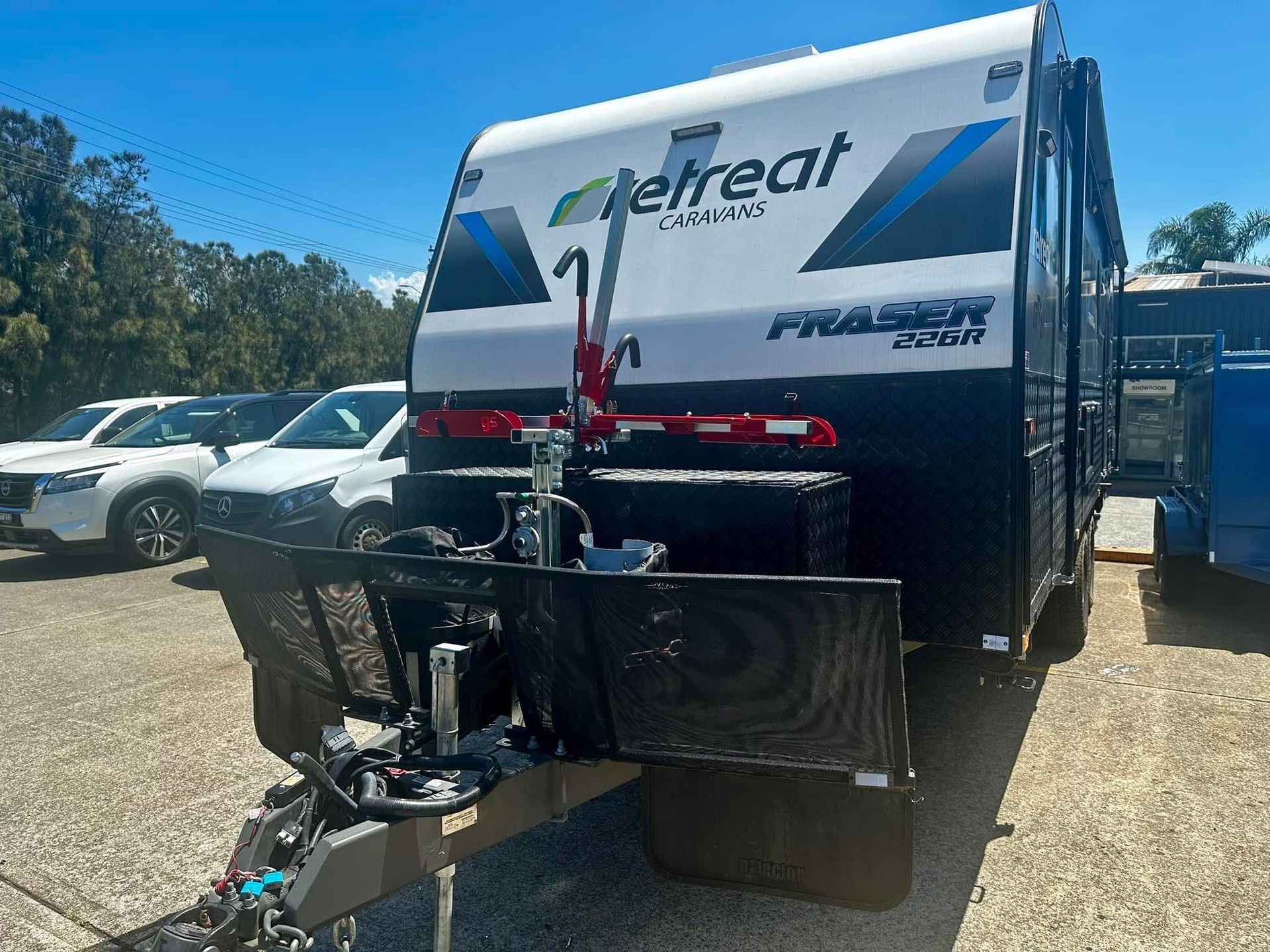 A Man Is Working on A Truck in A Garage — Bonetig's Mobile Towbars & Trailers In Oak Flats, NSW
