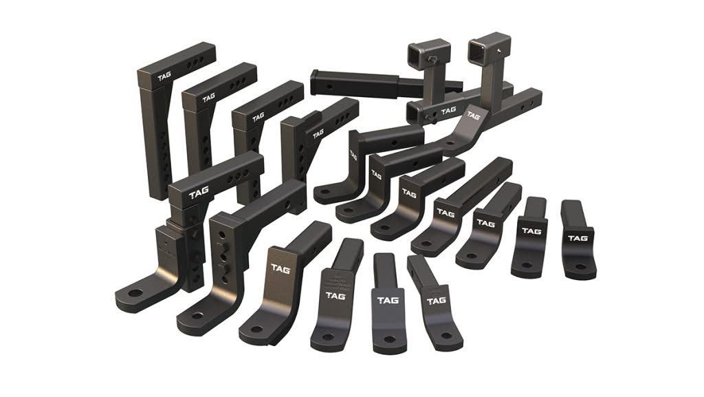 A Car Is Sitting on A Lift in A Garage — Bonetig's Mobile Towbars & Trailers In Oak Flats, NSW
