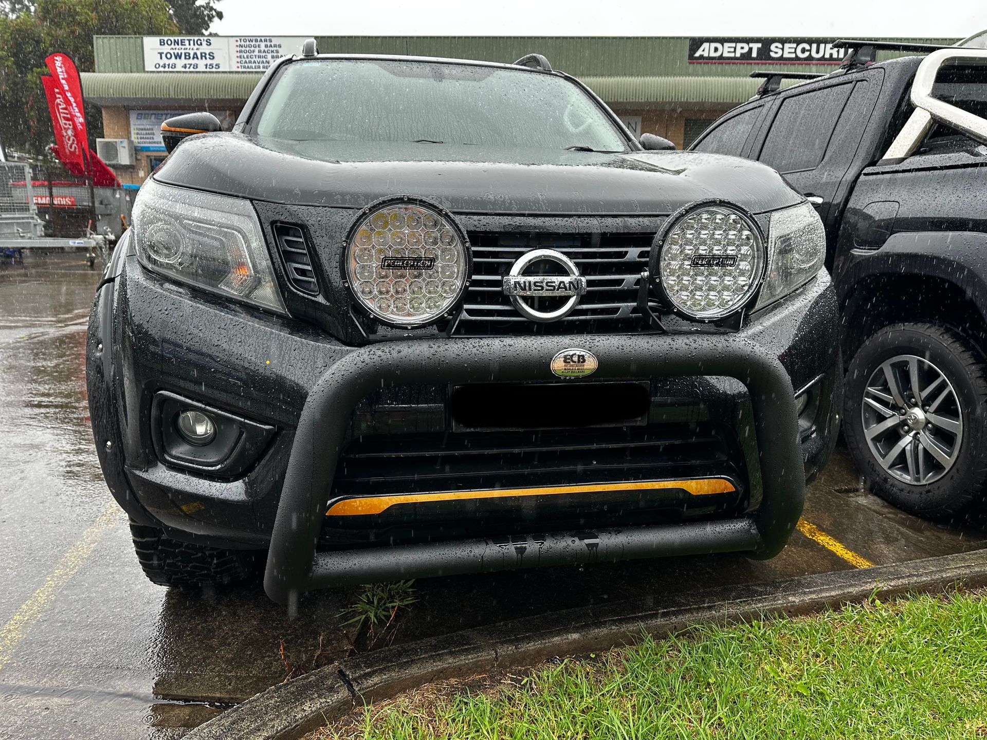 A Mitsubishi Outlander Is Parked in A Driveway Next to A Trailer — Bonetig's Mobile Towbars & Trailers In Oak Flats, NSW
