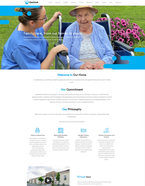 Woman in wheelchair with caregiver outdoors; website homepage.
