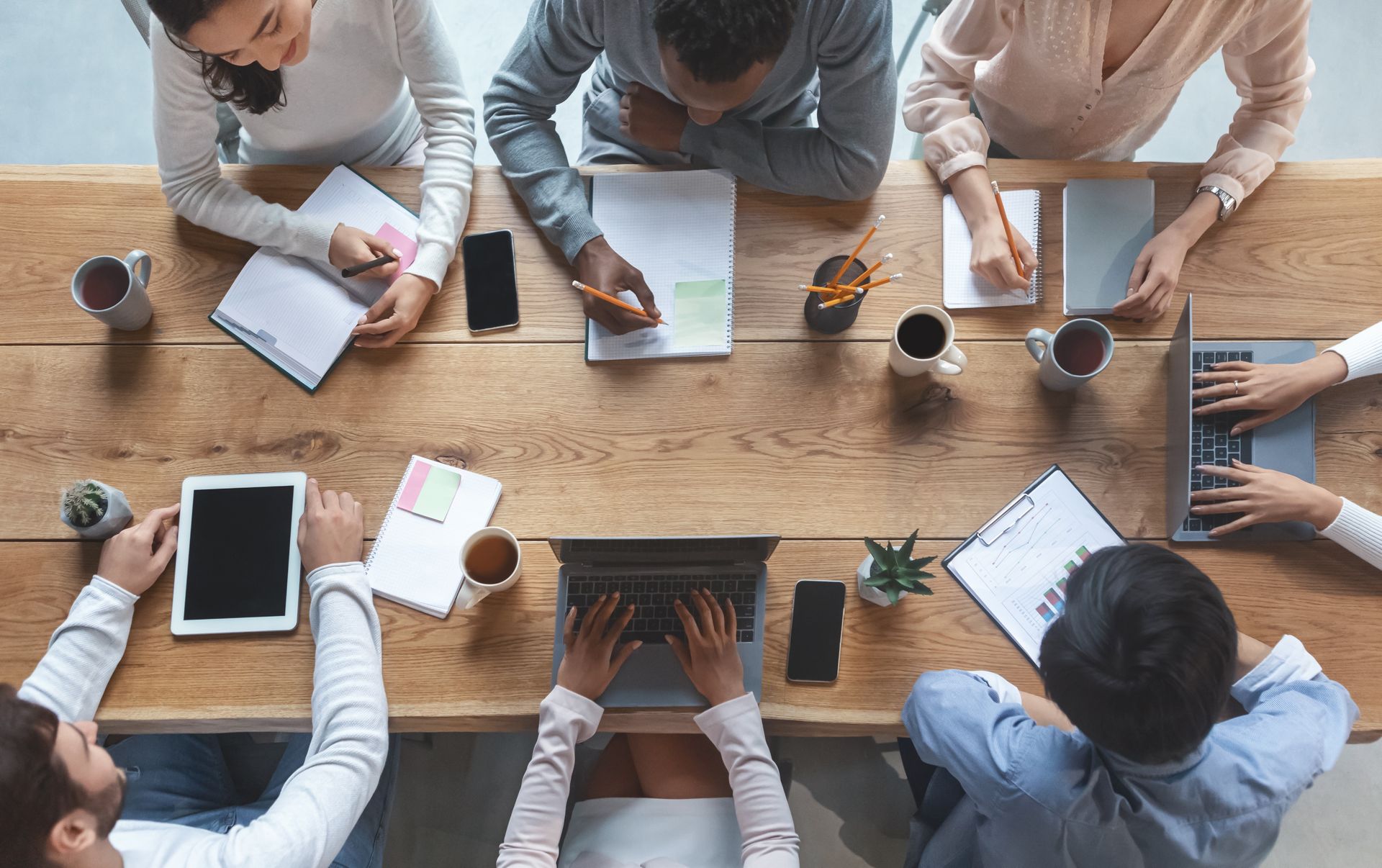 people working around a desk