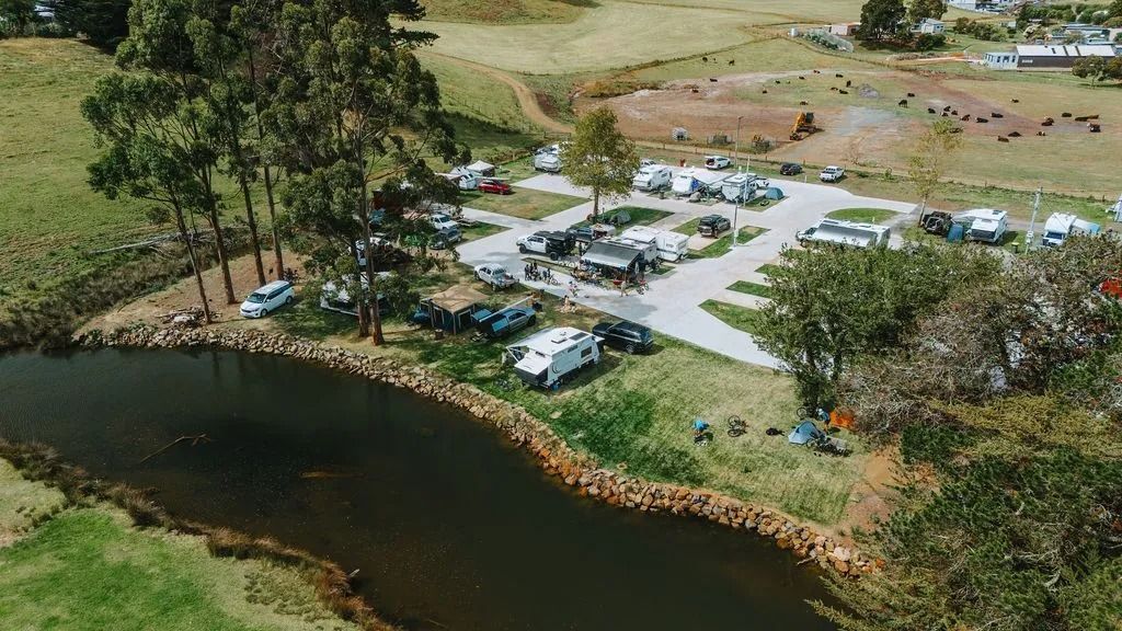 Aerial View Of A Sandy Beach Beside Trees and Parked Cars — Dover Caravan Park in Dover, TAS