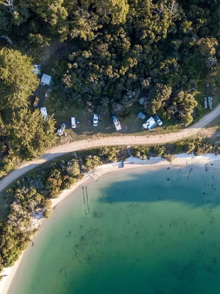 Aerial View Of A Tropical Beach With Turquoise Water — Dover Caravan Park in Dover, TAS