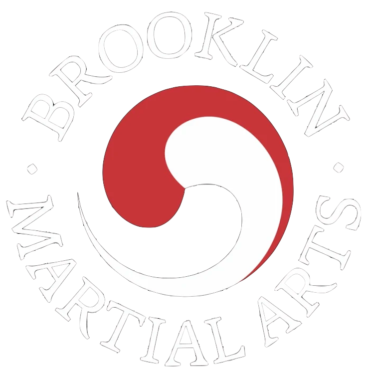 Brooklyn Martial Arts logo with black circle and red-and-white yin-yang symbol