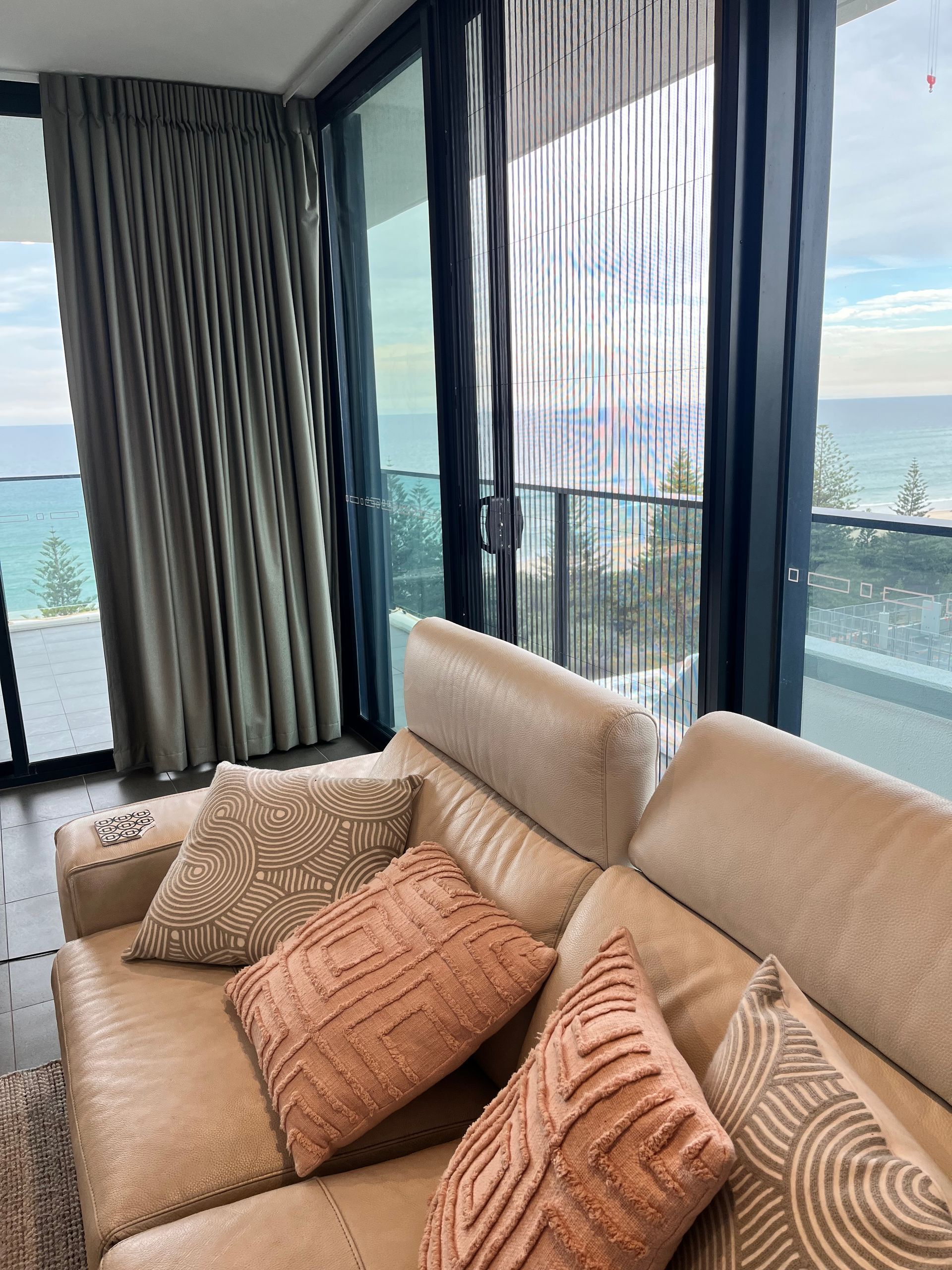 A Person Is Measuring A Window Blind With A Pencil — Budget Home Improvements In Tweed Heads South, NSW