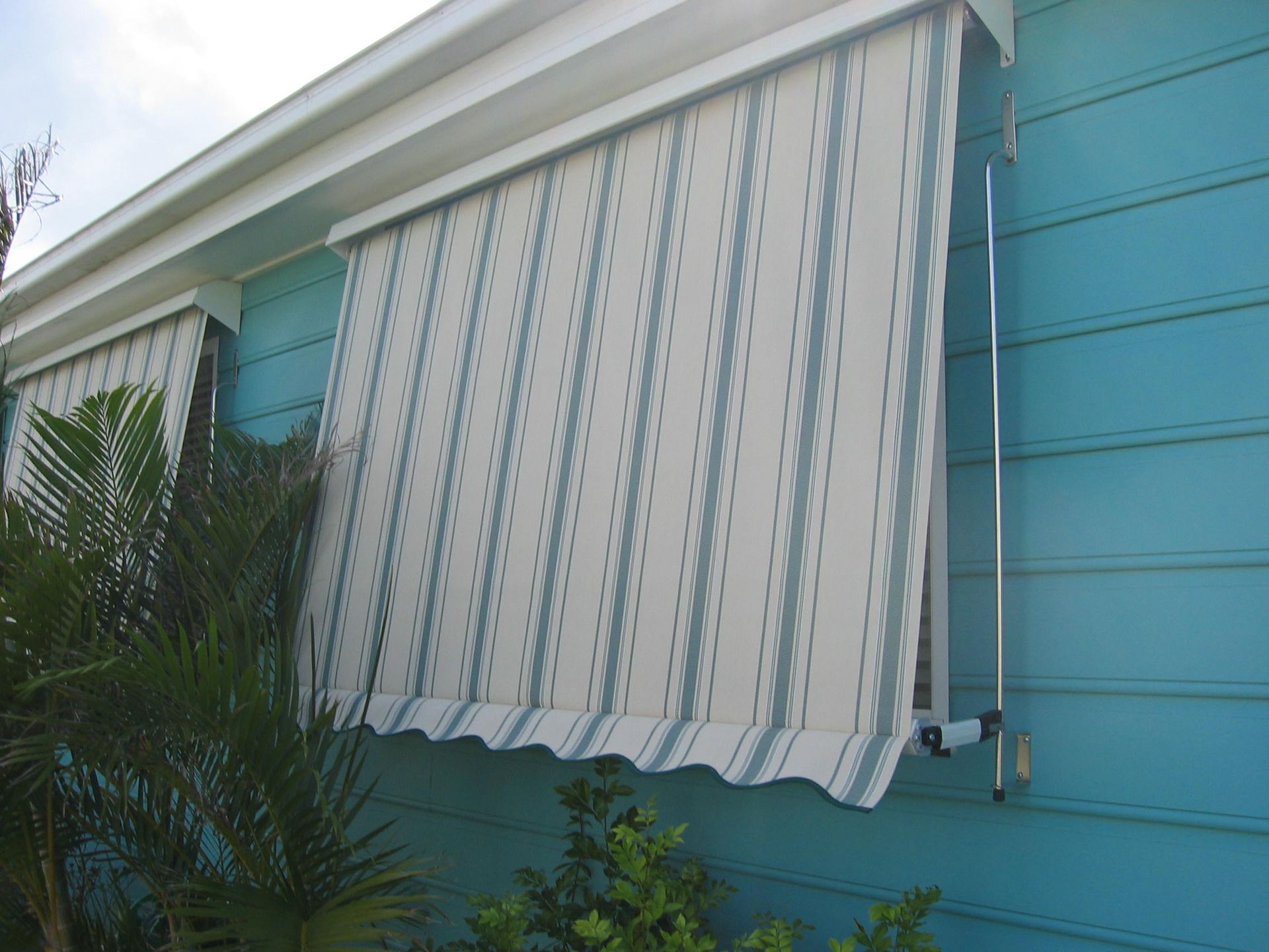 A Close Up Of A Sliding Glass Door With A Screen On It — Budget Home Improvements In Tweed Heads South, NSW
