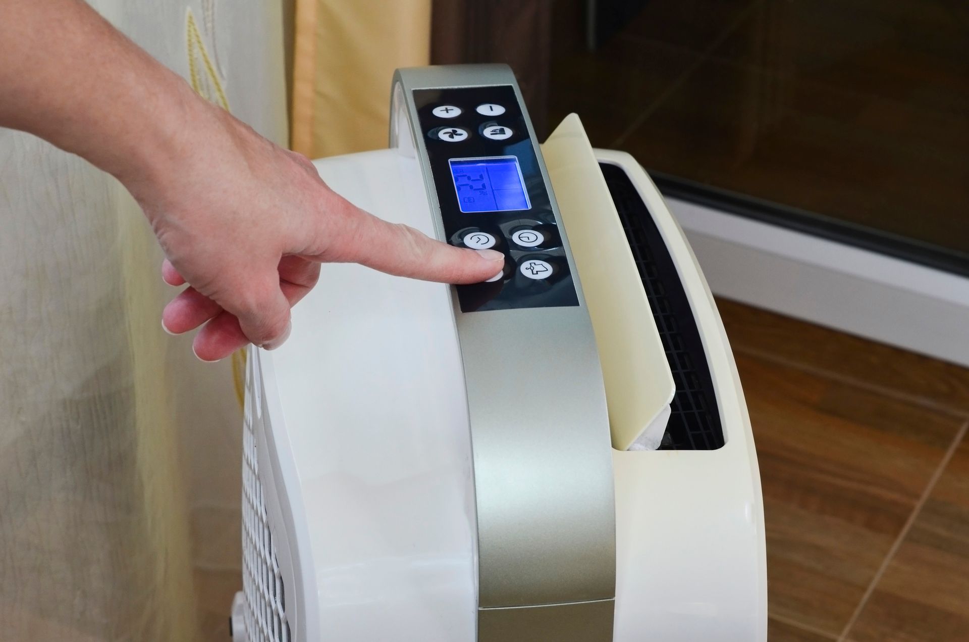 Portable dehumidifier in a home interior helping control indoor humidity in Gainesville, Florida.