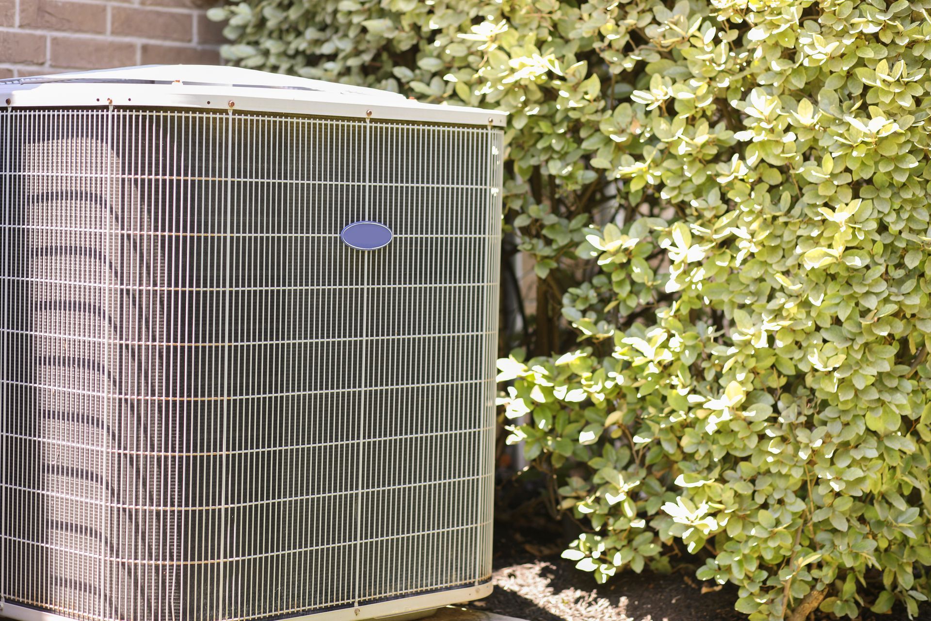 Residential outdoor air conditioning unit running during summer in Gainesville Florida by Jarvis.