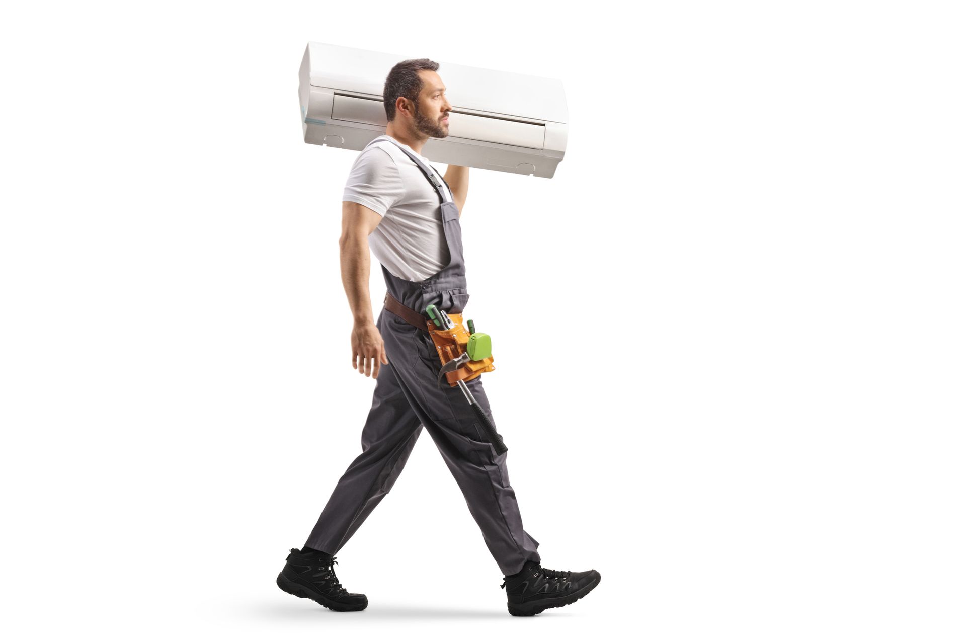 HVAC technician carrying a new indoor air conditioning unit for AC installation in Gainesville, FL.