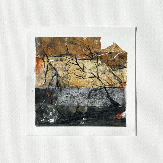 Abstract mixed-media artwork with dark gray, gold, and orange layers over a white background