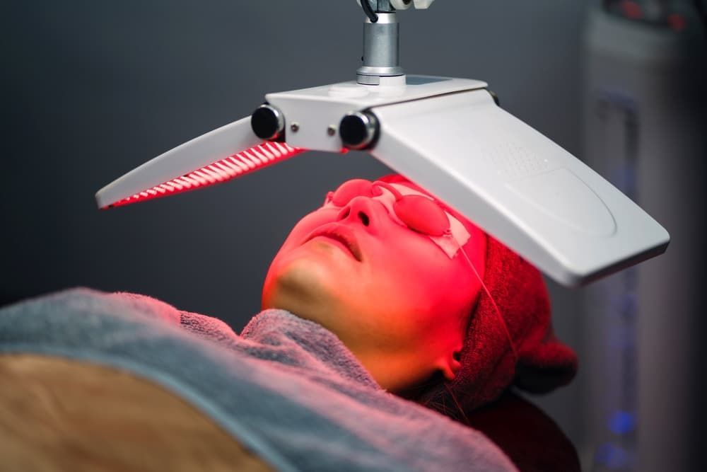 Woman Receiving Red Light Therapy Treatment — Embrace Cosmetic Clinic in Bundaberg North, QLD