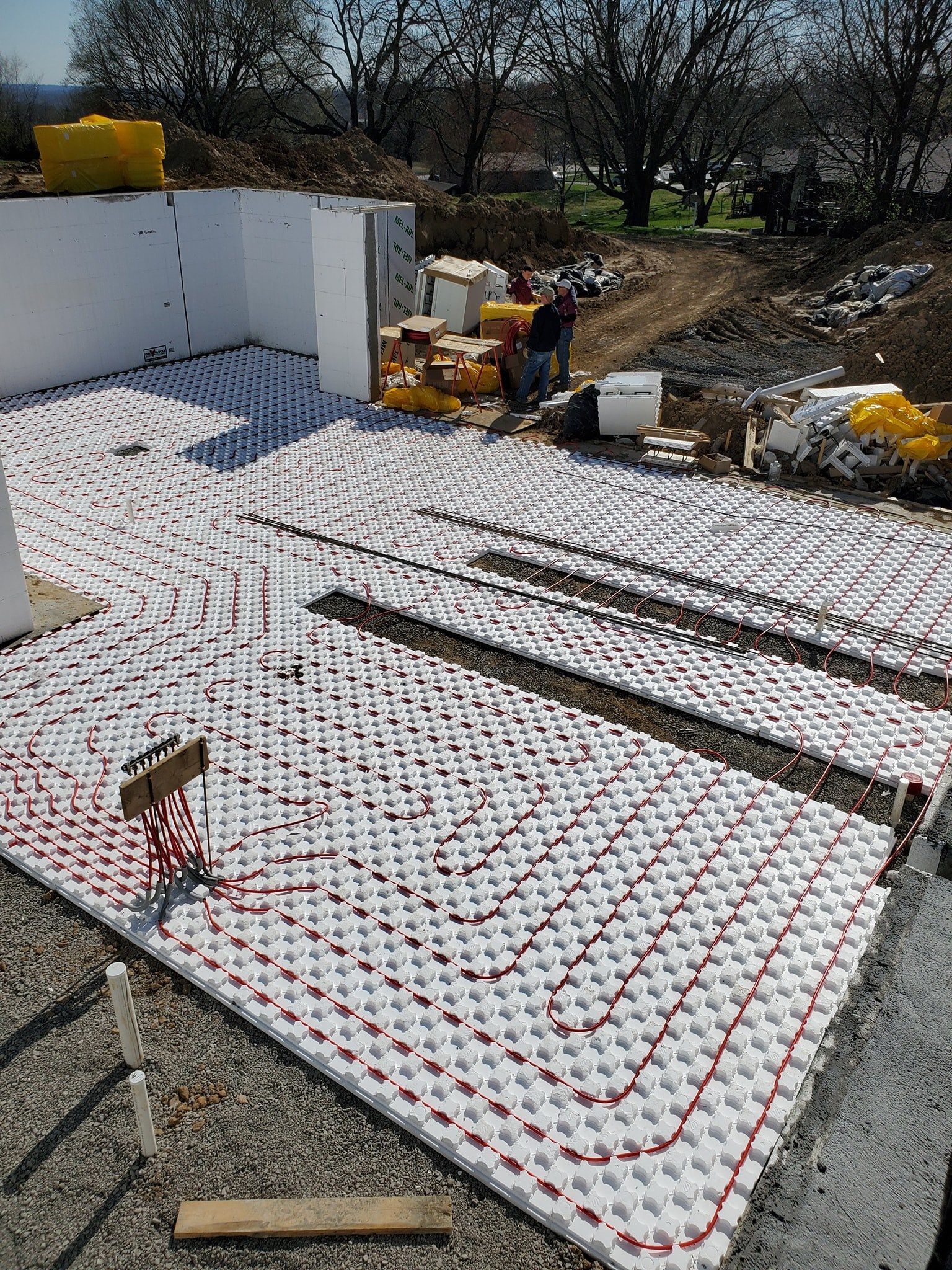 A construction site with a lot of white foam on the ground.