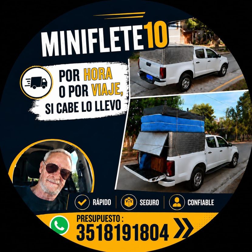 Camioneta blanca estacionada en una calle, con una gran caja de carga plateada en la parte trasera.