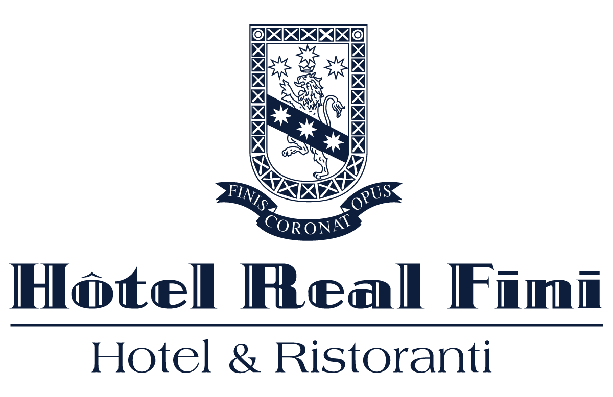 Logo dell'Hotel Real Fini con stemma e la scritta "Hotel & Ristoranti"