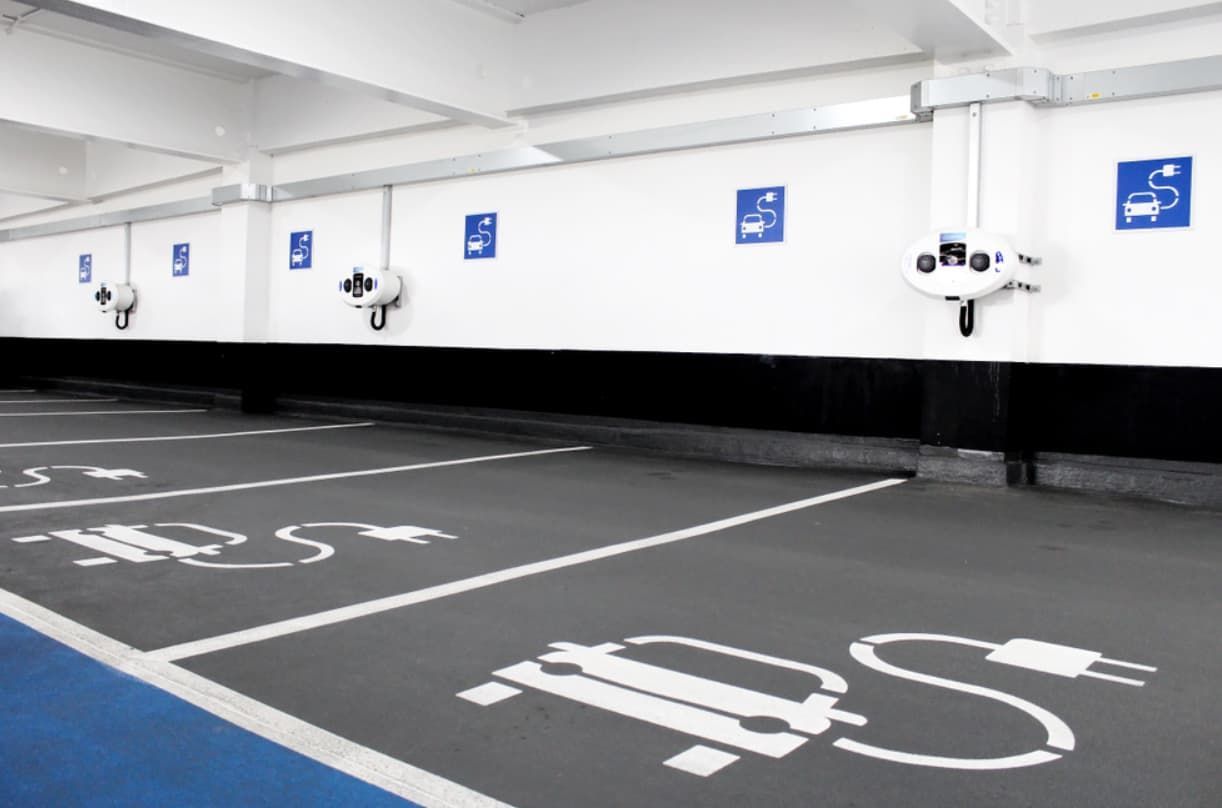 A Parking Garage With A EV Sign On The Wall — Ultra Mechanics / EV Drive In Warana, QLD