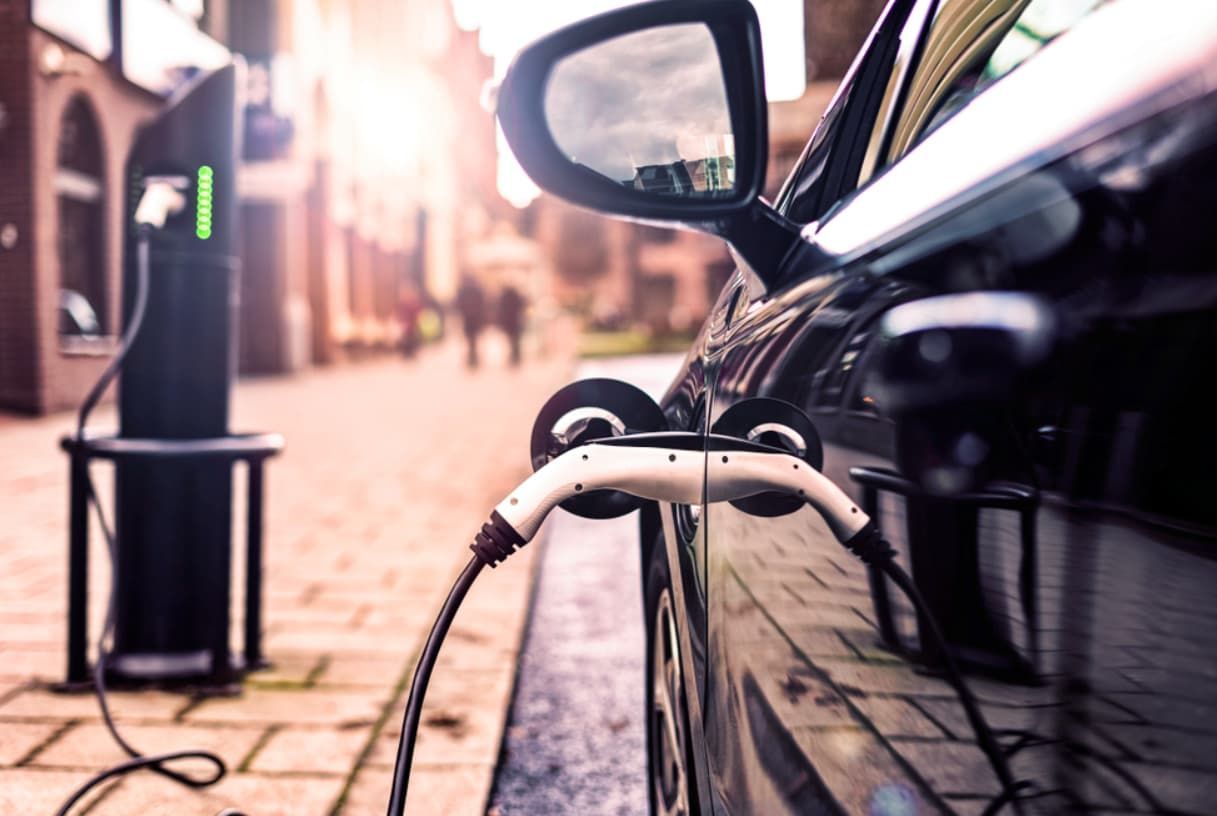 An Electric Car Is Being Charged At A Charging Station — Ultra Mechanics / EV Drive In Warana, QLD