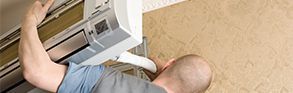 Electrician Fixing Air Condition — Electrical Service in Mackay, QLD