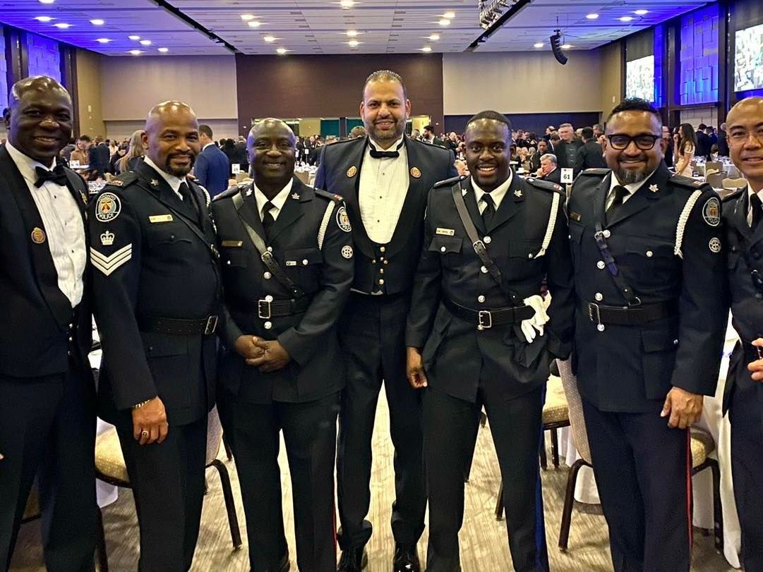 a group of police officers pose for a photo a group of police officers pose for a photo