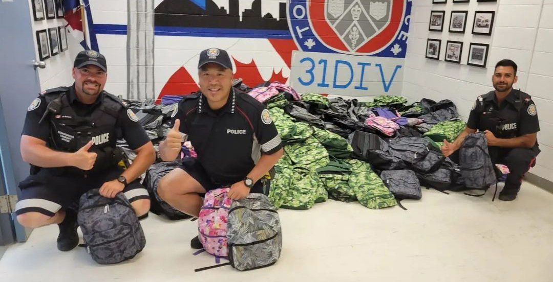 NCOs with backpacks for students