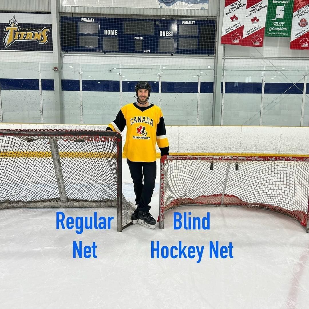 a hockey player stands in front of a regular net and a blind hockey net