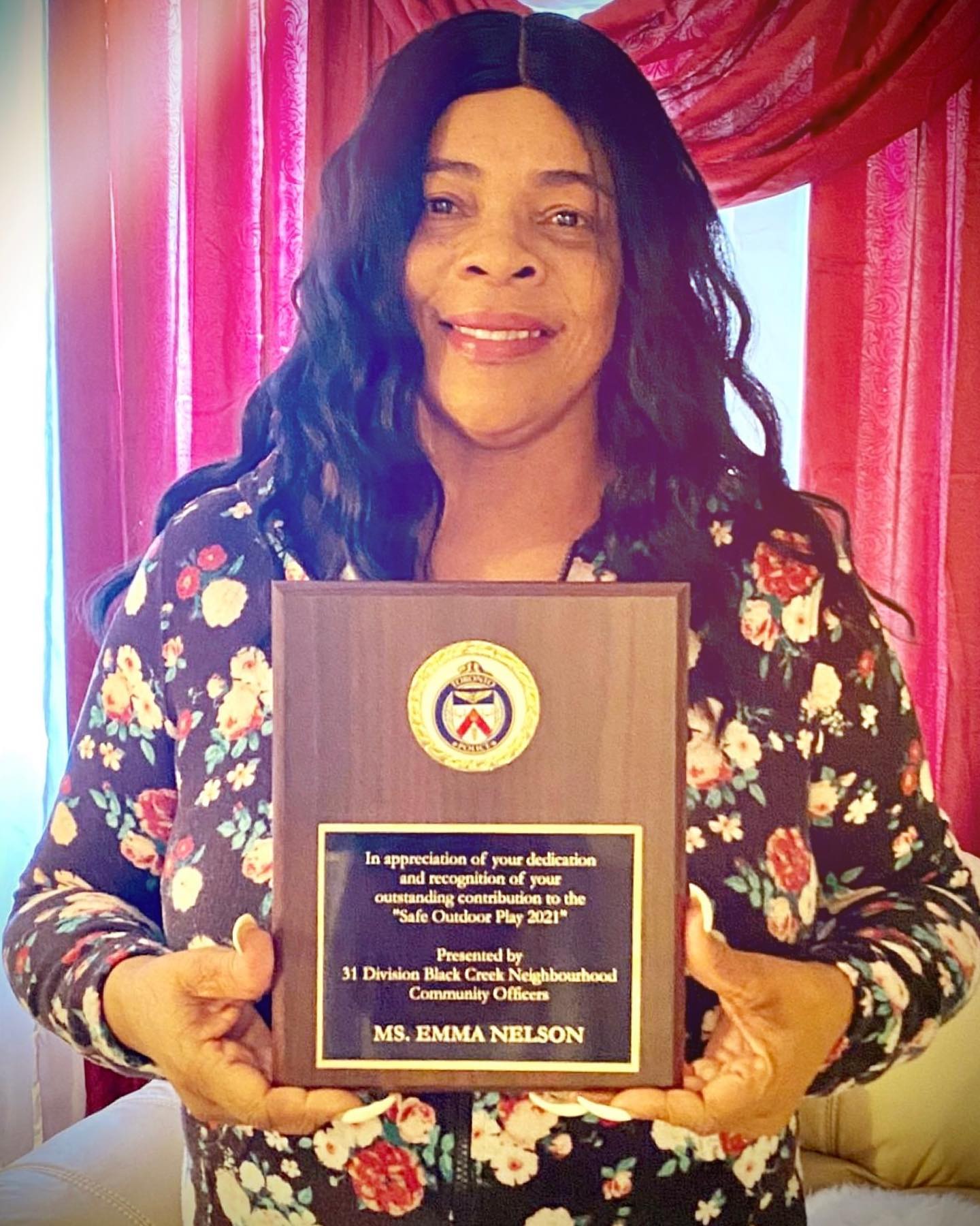 Ms. Emma holding appreciation award