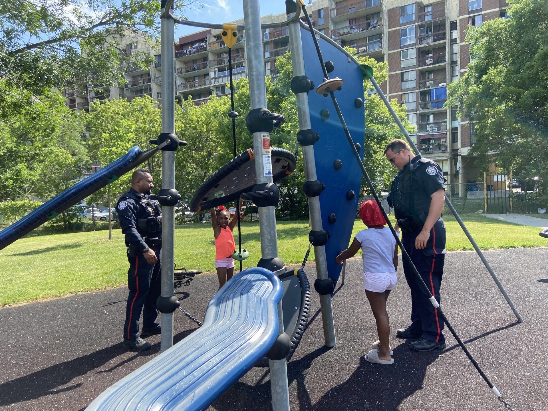 Officers playing with children in the park