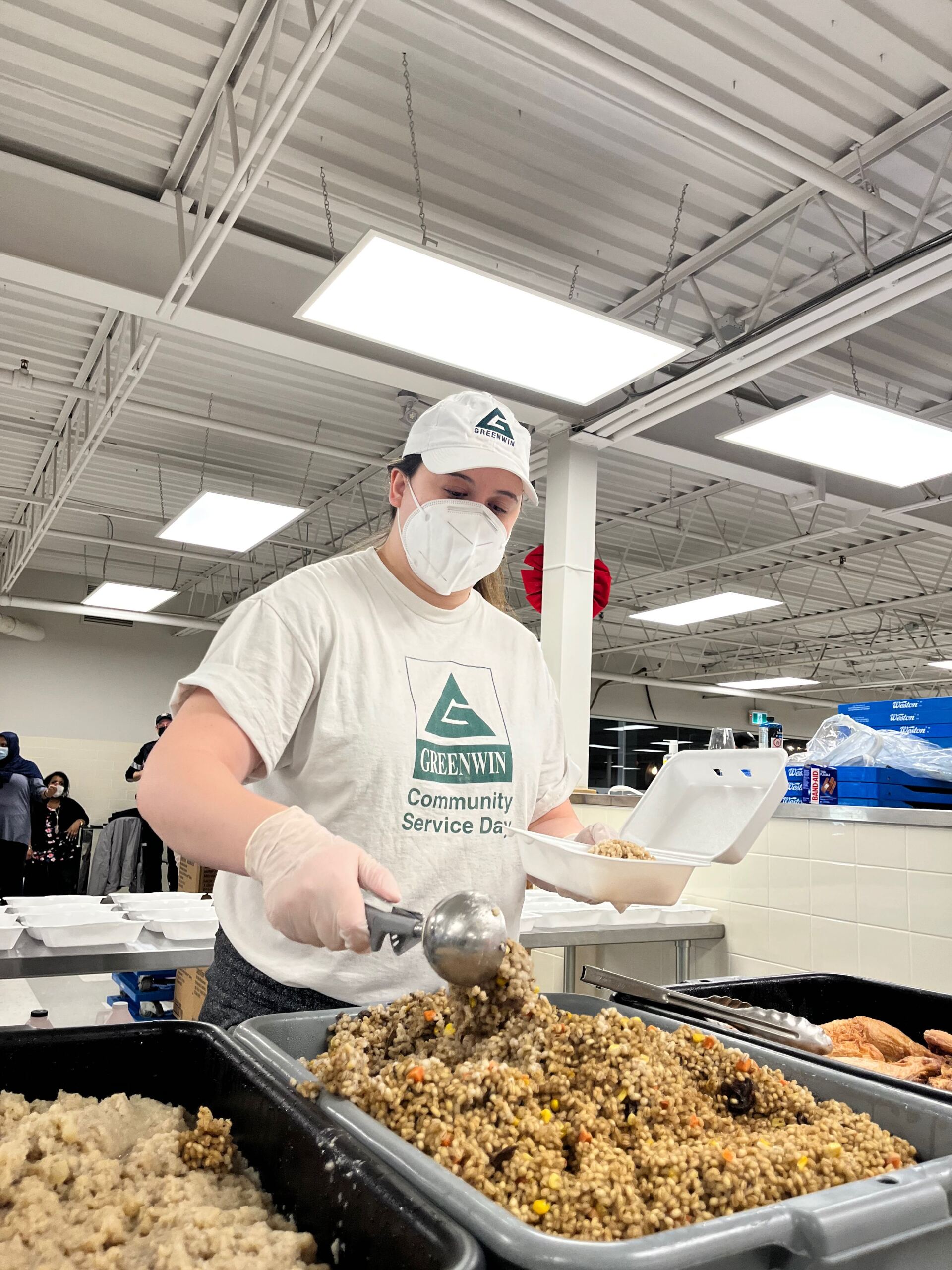 Volunteer preparing food