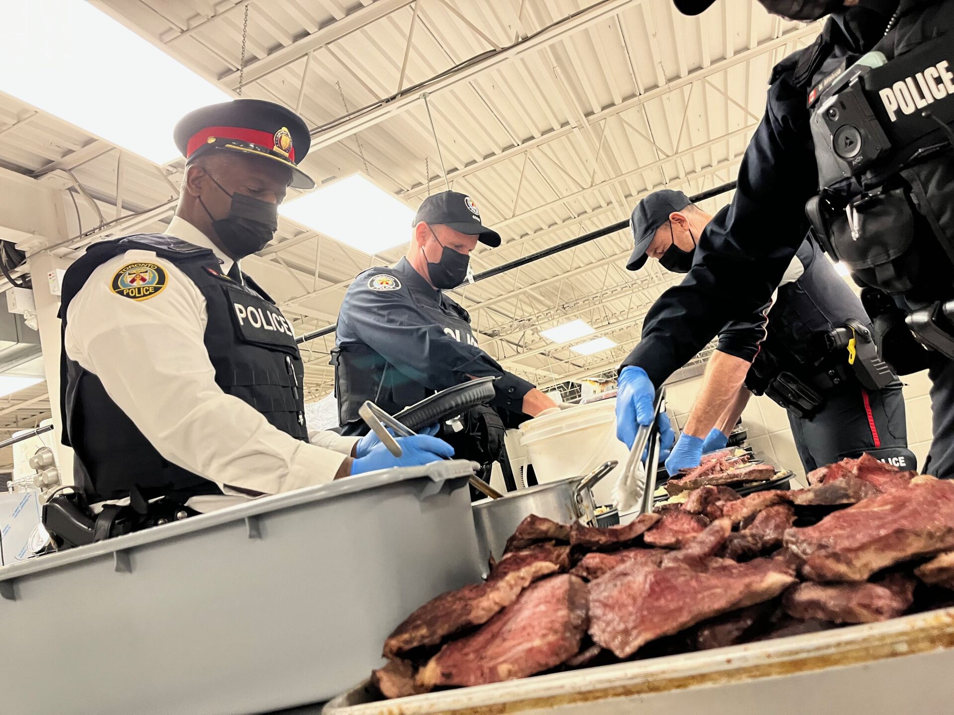 Superintendent Ronald Khan and his officers preparing food Superintendent Ronald Khan and his officers preparing food