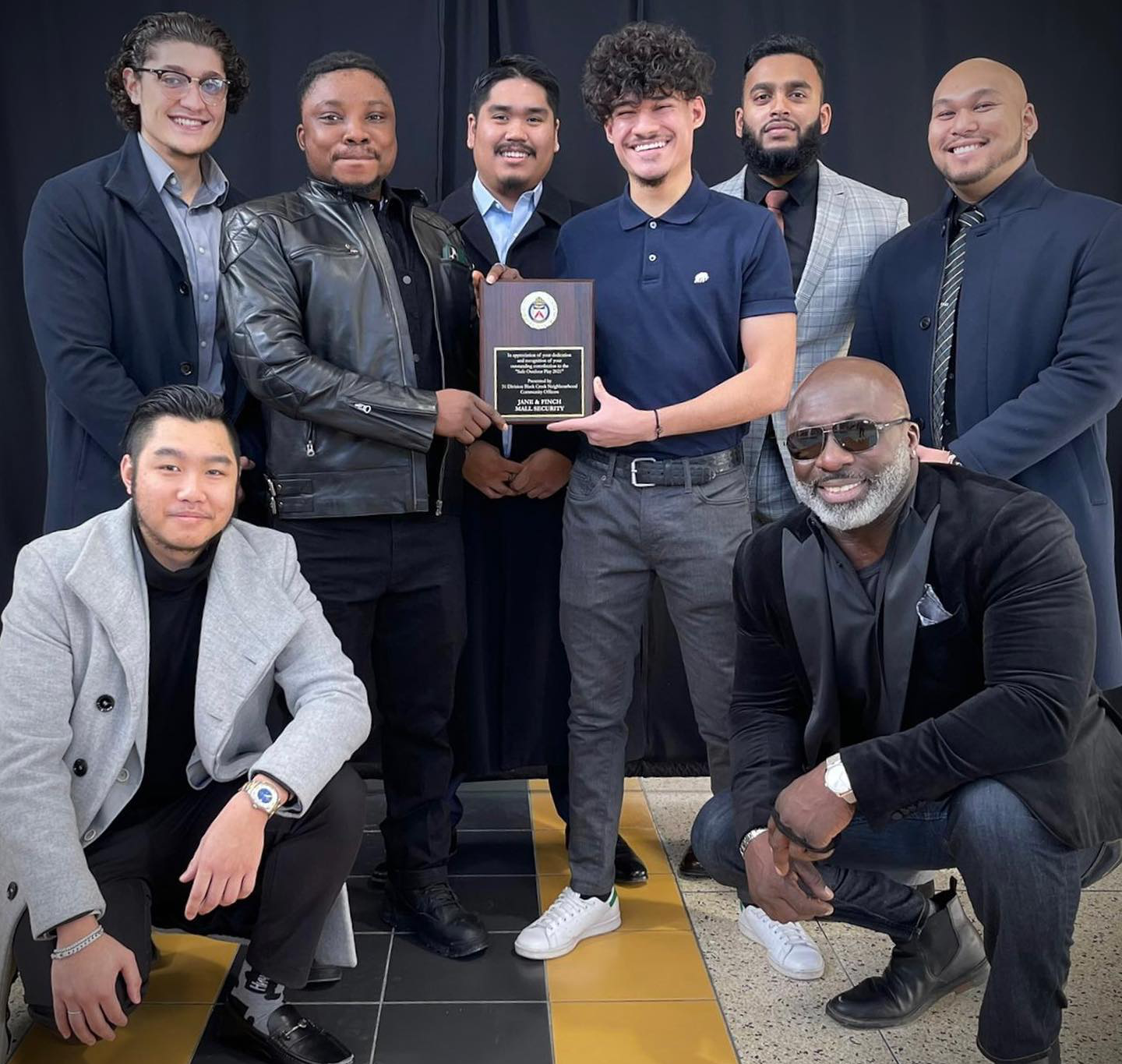 Security personnel from Jane Finch Mall receiving an award