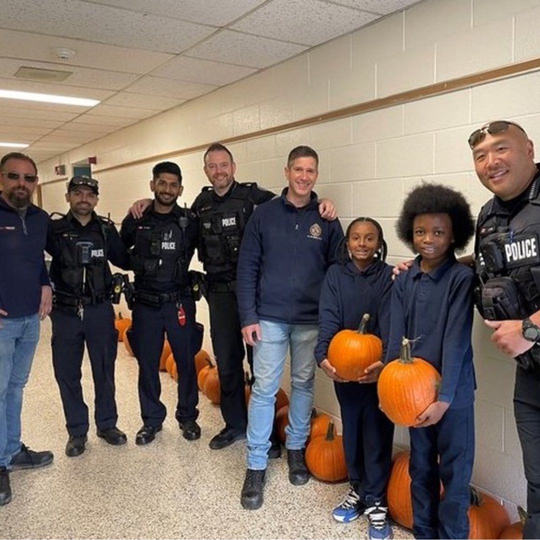 Photo of with children and officers