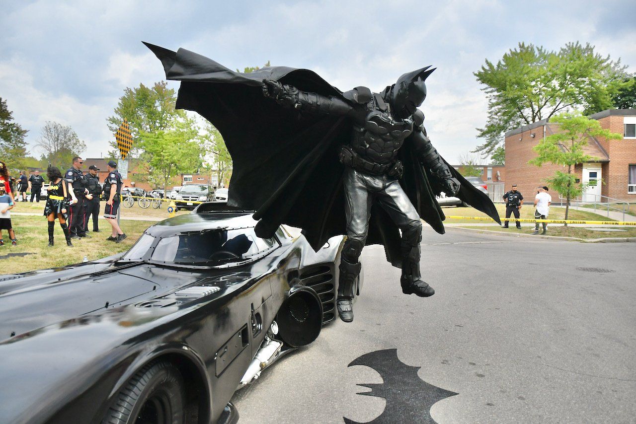 Batman jumping off his car